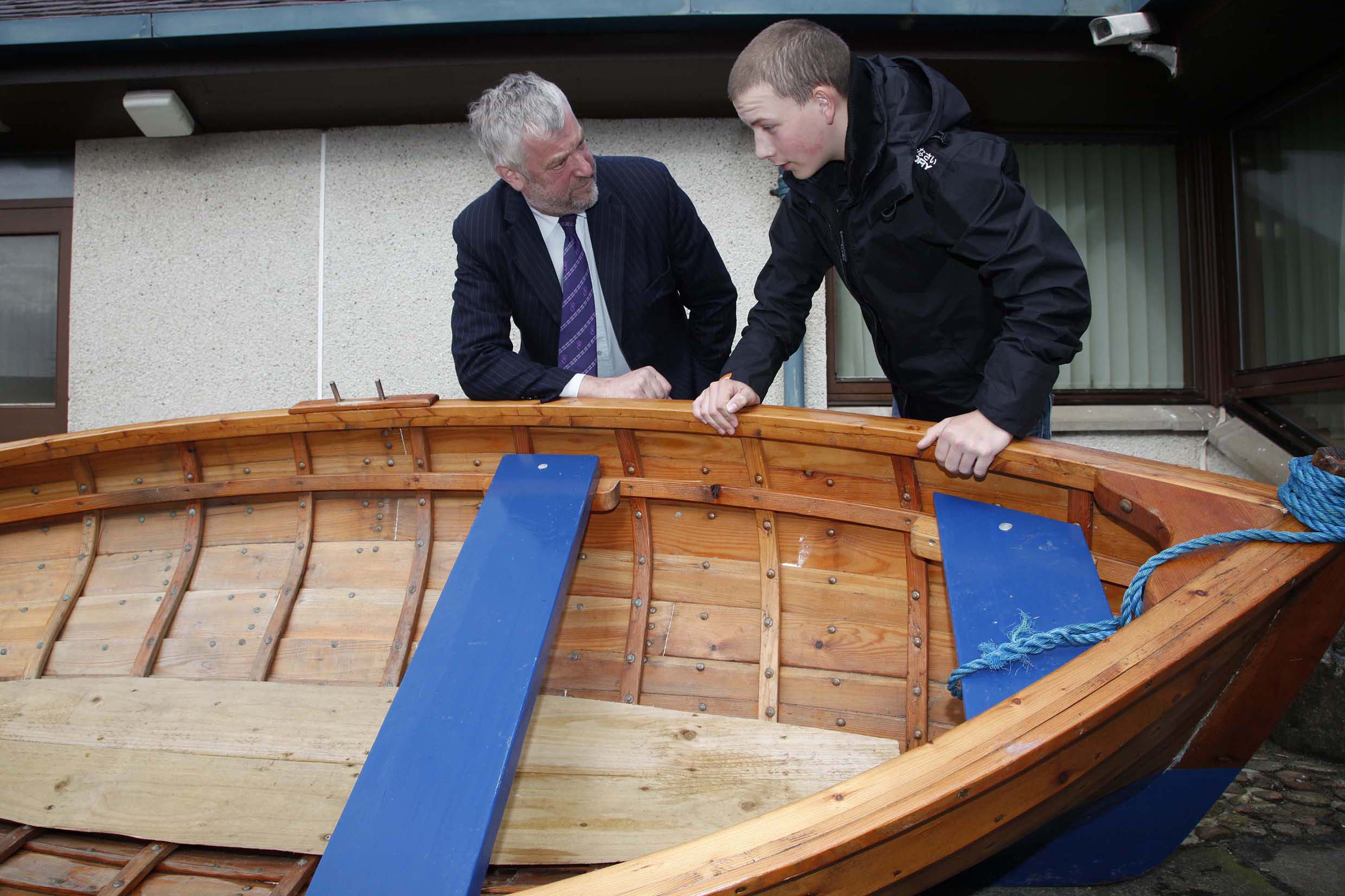 Presiding Officer Alex Fergusson is shown a Grimsay boat by Duncan MacDonald, 2010.